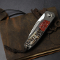 Preview: 25/077 German Edition Fuller iMamba brown/orange Arno Bernard Knives Kudu Bone + Titanium RWL-34 - Framelock