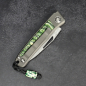 Preview: Rinkhals - Arno Bernard Knives - Damascus steel titanium skeletonized slipjoint pocket knife with mammoth molar tooth green