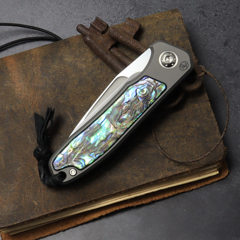 25/083 German Edition Fuller - Arno Bernard Knives - iMamba titanium knife / folder for the first time with an abalone blade made of RWL-34 steel