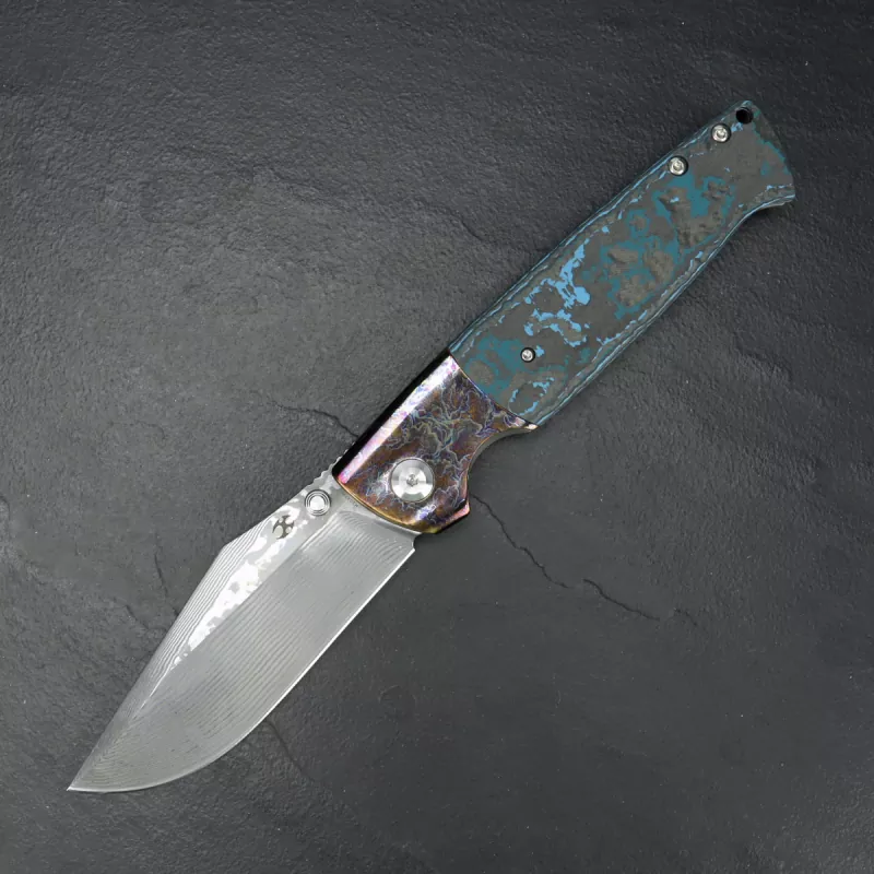 Kansept Shikari with anodized bolsters and clip Damascus blade with FAT carbon handle