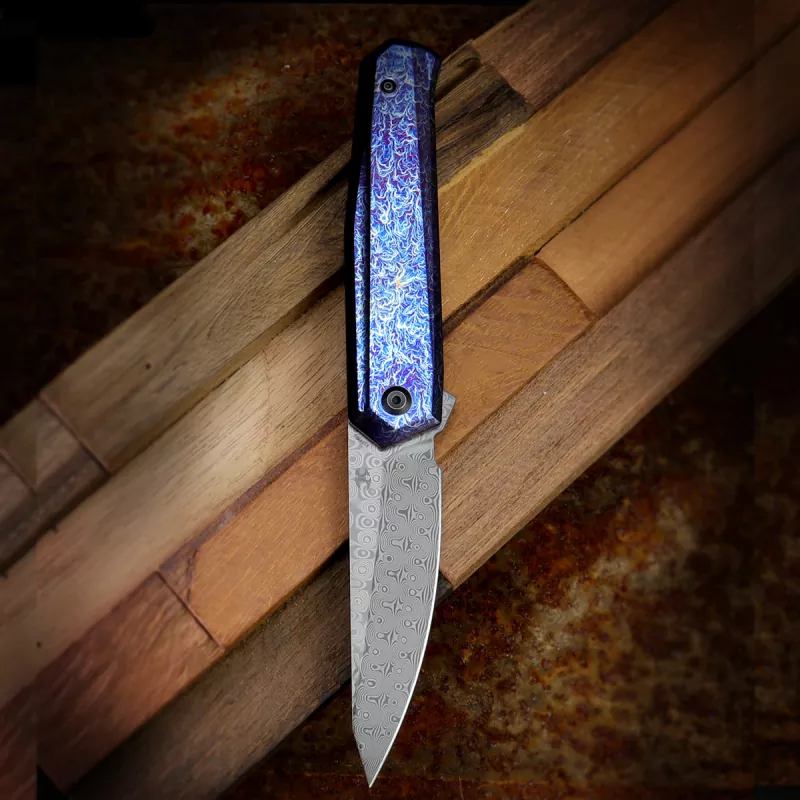 Kansept Integra Damascus blade with anodized titanium handle in Lightning Strike designed by JK Knives
